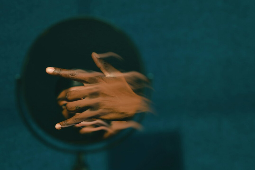 person practicing speech in mirror