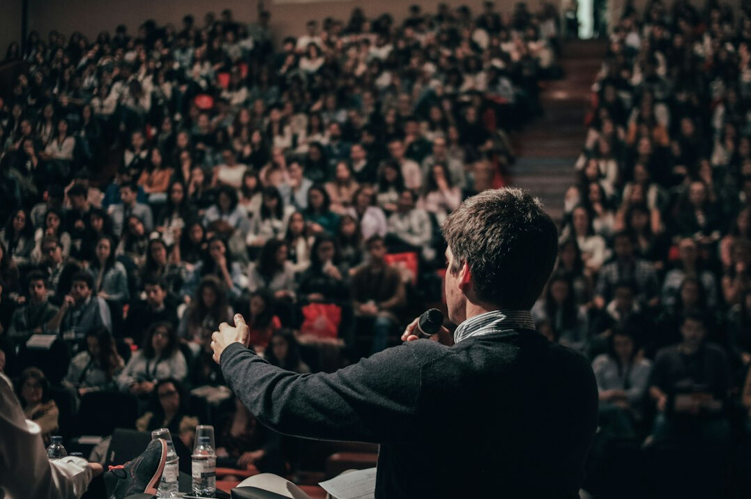 audience listening to speaker